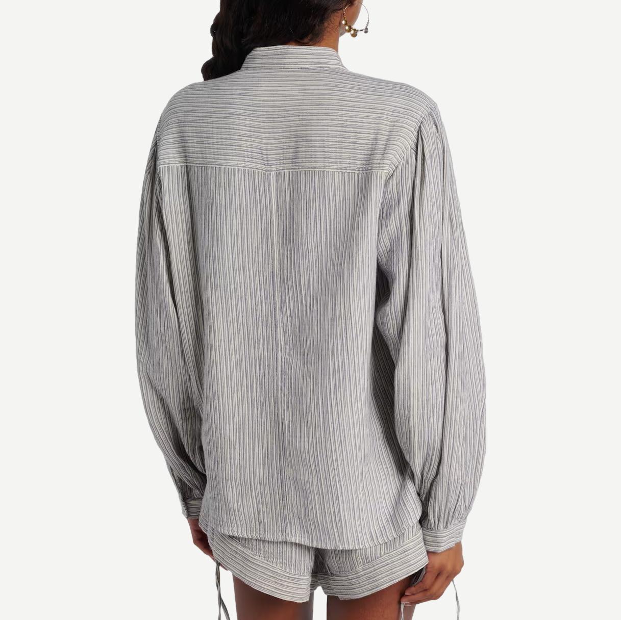 Isabel Marant Selvia Blue shirt with a relaxed fit, featuring long sleeves and a classic collar, displayed on a hanger.