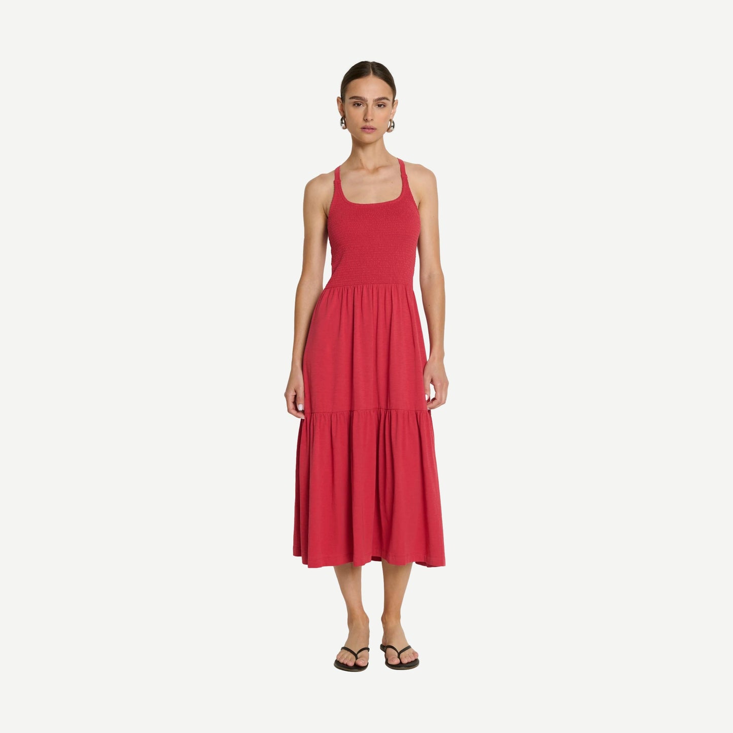Nation LTD Penelope Cross Back Midi Dress in Heartbeat Red, featuring a flowy silhouette and cross-back design, displayed on a hanger.