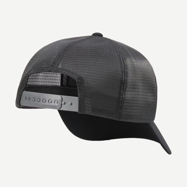 Black and cloud-colored Arcteryx Bird Word Trucker Hat with adjustable snapback and mesh back for ventilation.