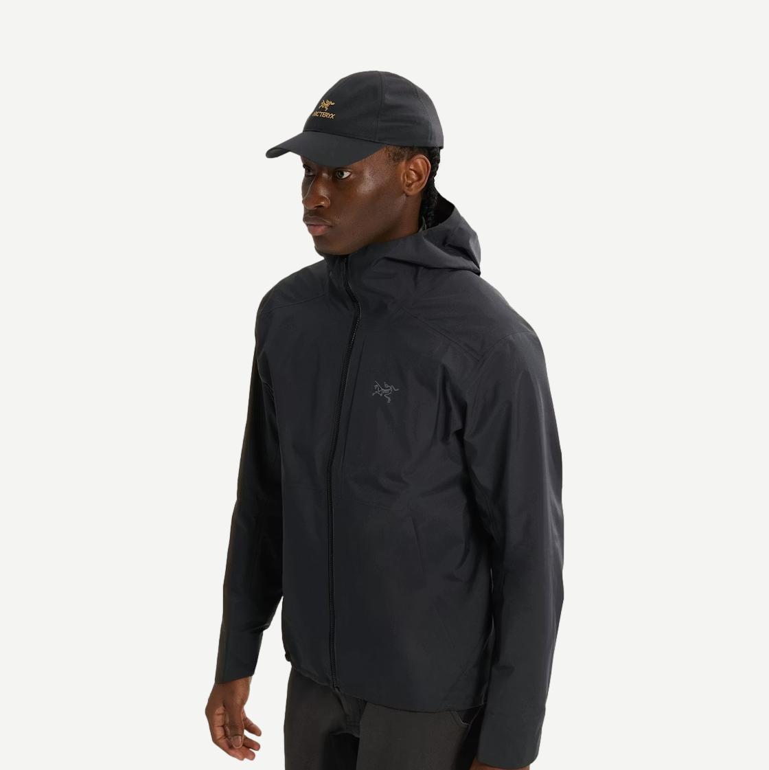 Black Bird Word Cap by Arc'teryx featuring embroidered bird logo and adjustable strap, stylish and functional hat for outdoor wear