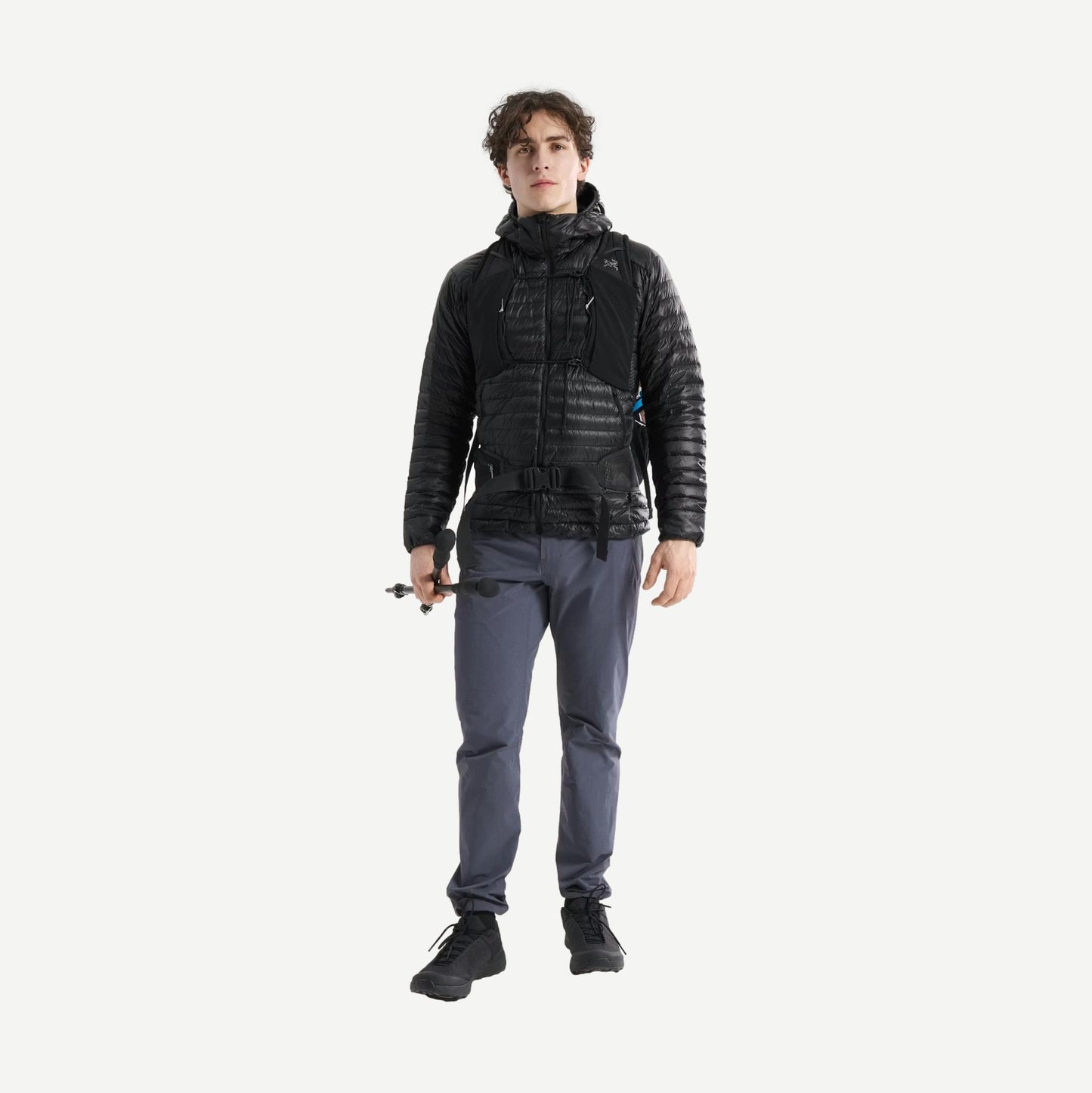 Black Arcteryx Cerium SL Hoody jacket shown on a full-body model, highlighting its lightweight design and outdoor-ready style.