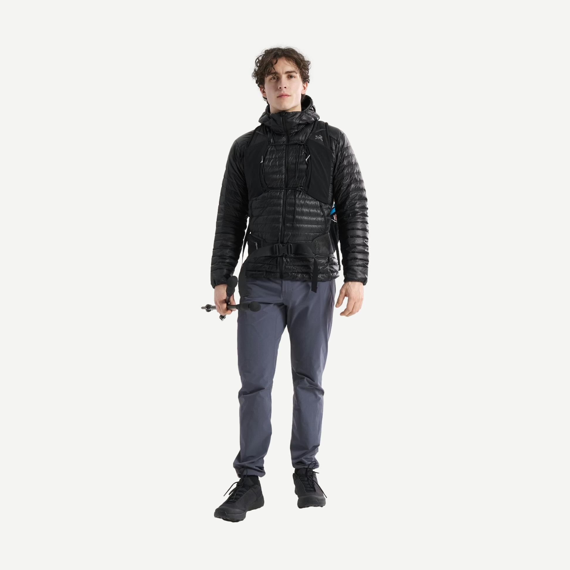 Black Arcteryx Cerium SL Hoody jacket shown on a full-body model, highlighting its lightweight design and outdoor-ready style.