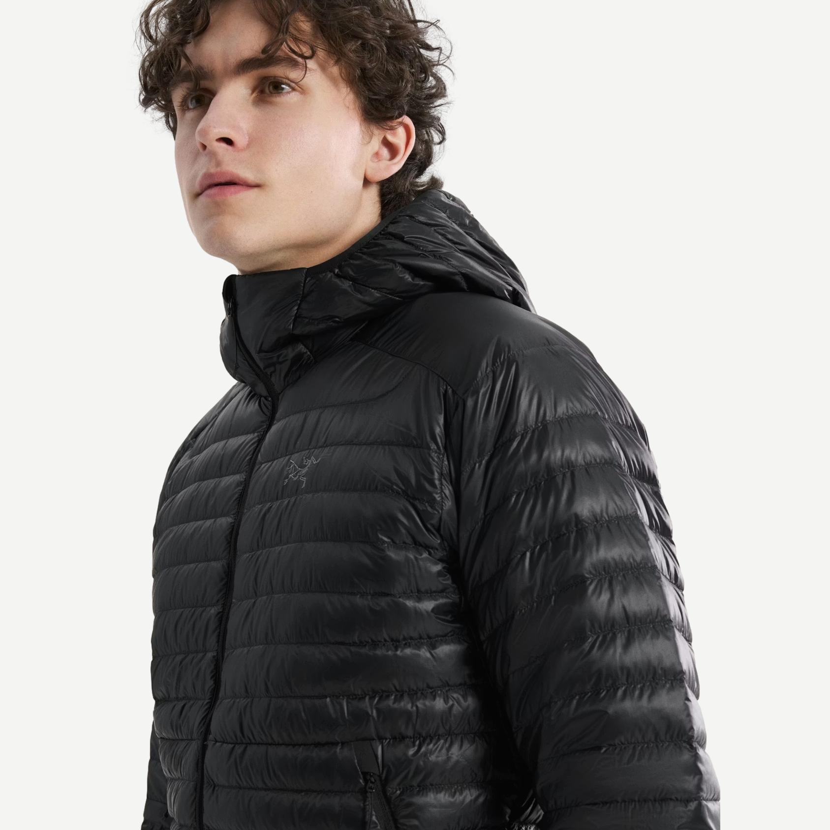 Black Arcteryx Cerium SL Hoody jacket shown on a hanger, featuring a lightweight, insulated design for outdoor activities.