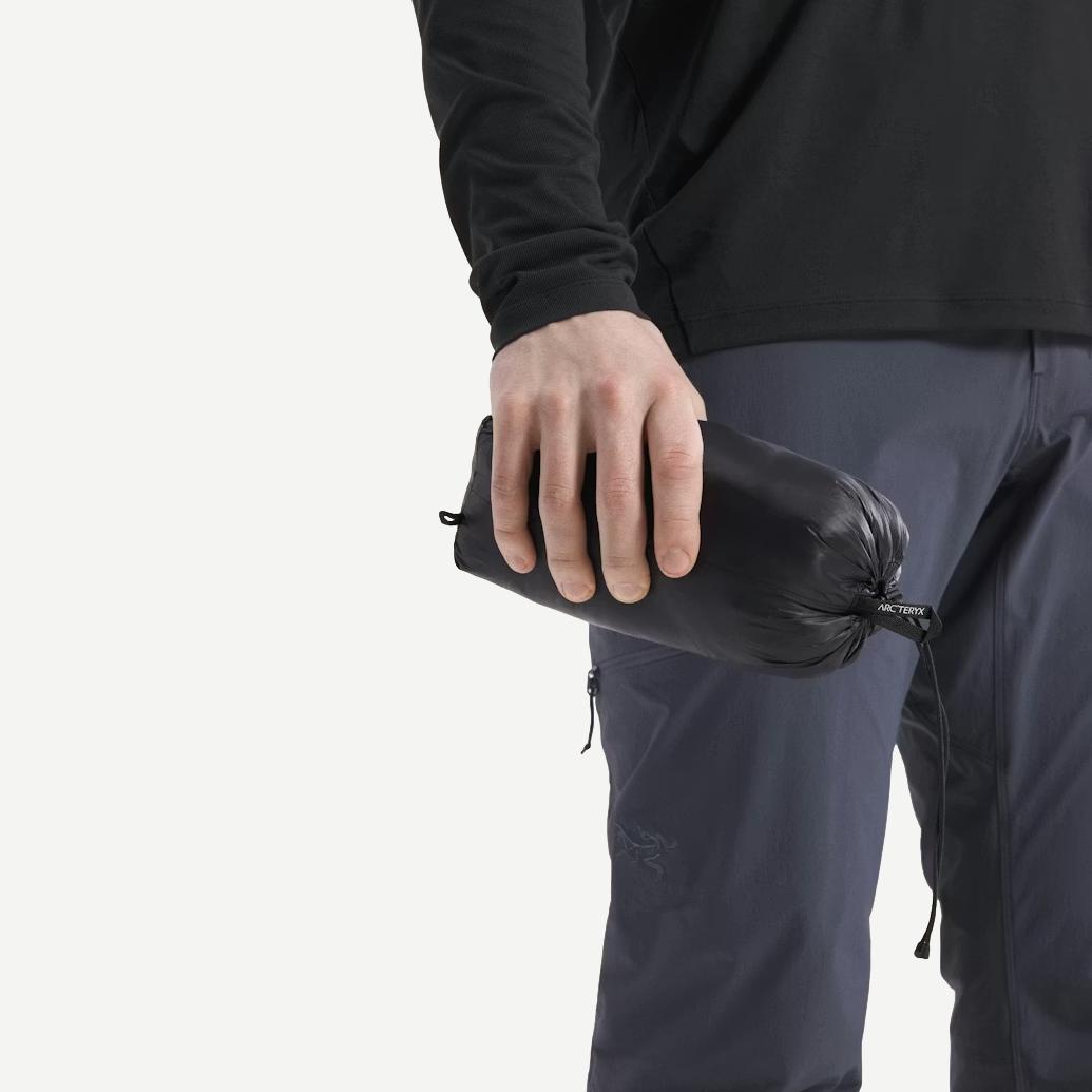 Black Arcteryx Cerium SL Hoody jacket folded with visible fabric texture and branding details.