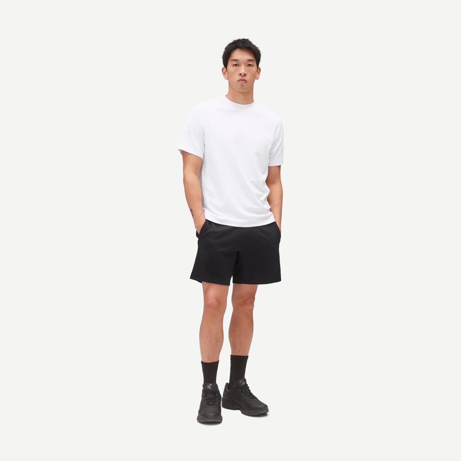 Reigning Champ Solotex Mesh Tiebreak 7-inch shorts in black, featuring lightweight breathable fabric and athletic fit.