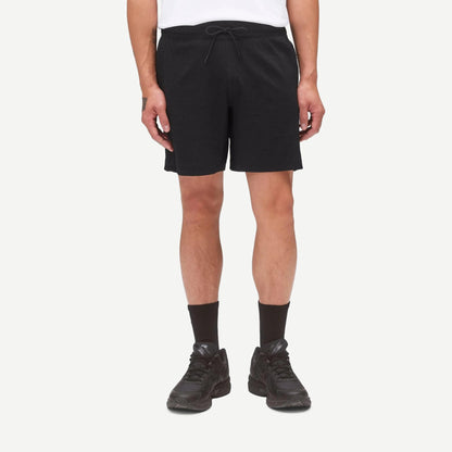 Reigning Champ Solotex Mesh Tiebreak Short 7-inch in black, lightweight athletic shorts with mesh fabric and elastic waistband.