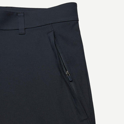 Reigning Champ navy Stretch Warp Knit Coach's Slim Pants displayed flat with waistband and tapered leg details.