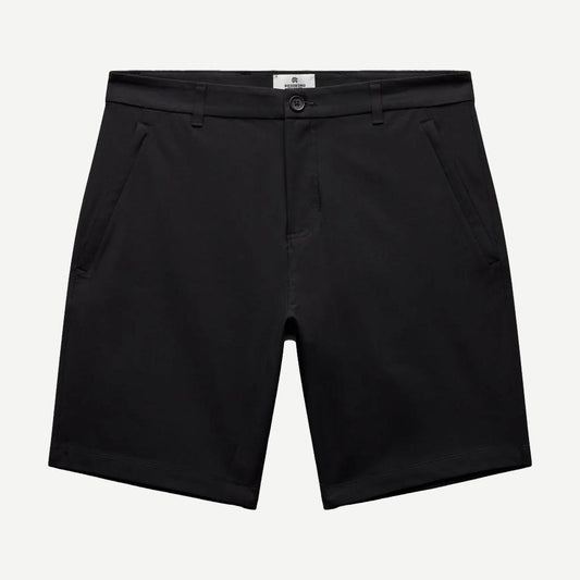Black Reigning Champ Stretch Warp Knit Coach's Slim Shorts 9-inch length displayed on a model.