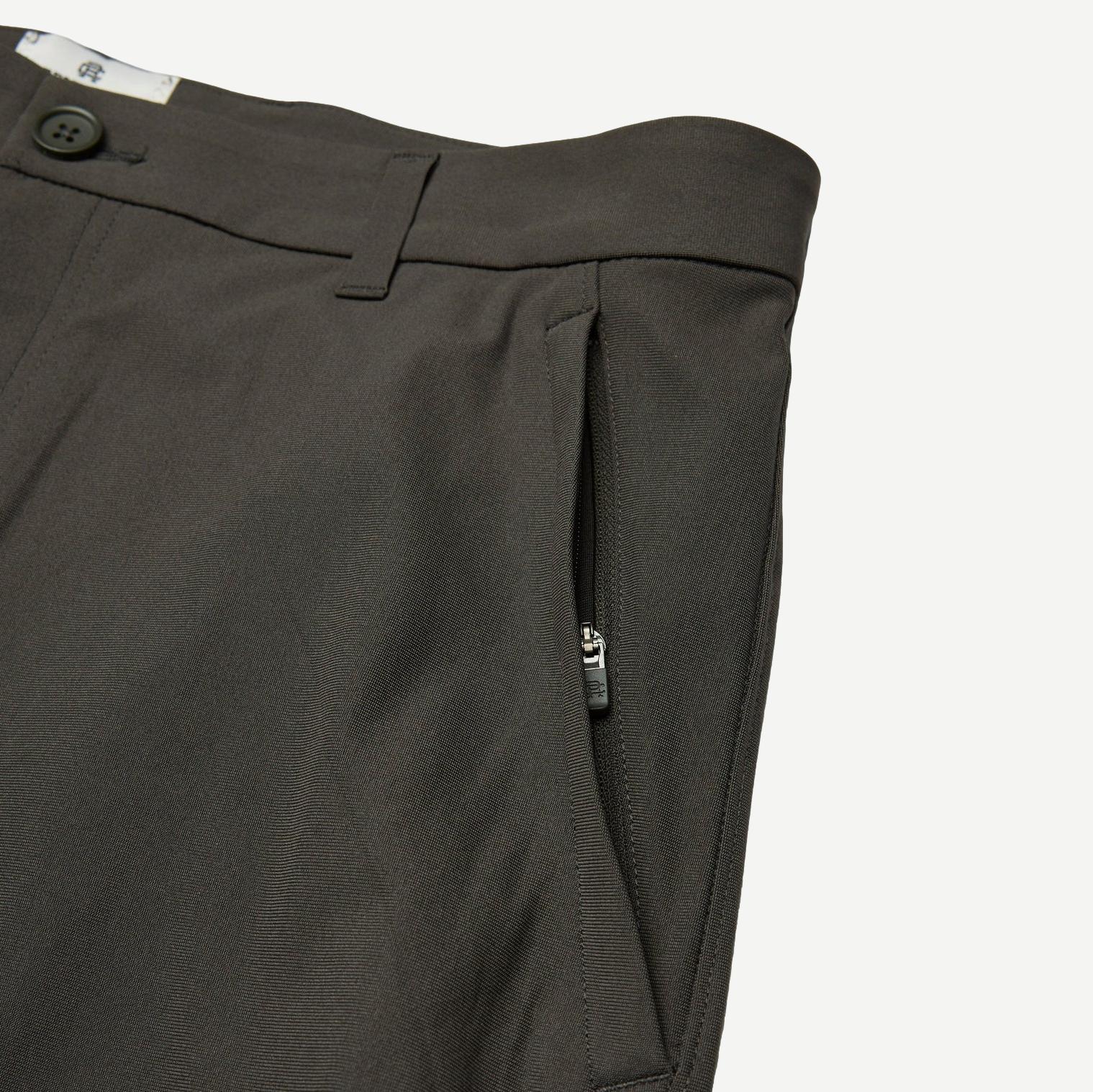 Reigning Champ Stretch Warp Knit Coach's Slim Shorts 9-inch in carbon color, featuring a close-up view of the fabric and fit.