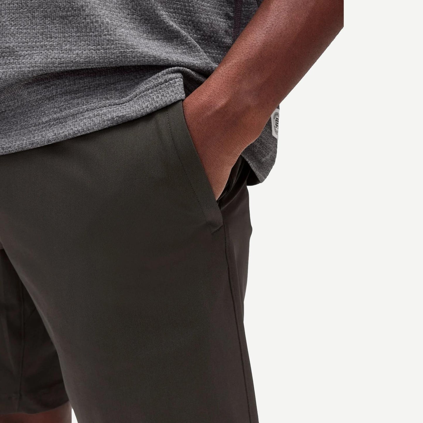 Reigning Champ Stretch Warp Knit Coach's Slim Short 9-inch in carbon color, shown on a model.