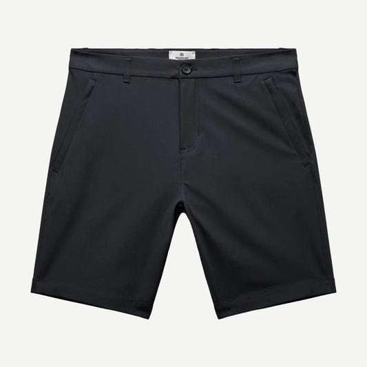 Reigning Champ navy stretch warp knit coach's slim shorts, 9-inch inseam, casual fit, shown on a model.