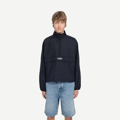 Black lightweight pullover jacket by Stussy, shown on a model with a relaxed fit and subtle branding details.