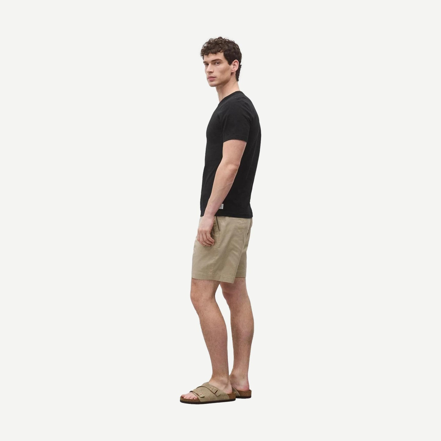 Black Reigning Champ lightweight jersey slim T-shirt displayed flat, showing its soft fabric and simple design.