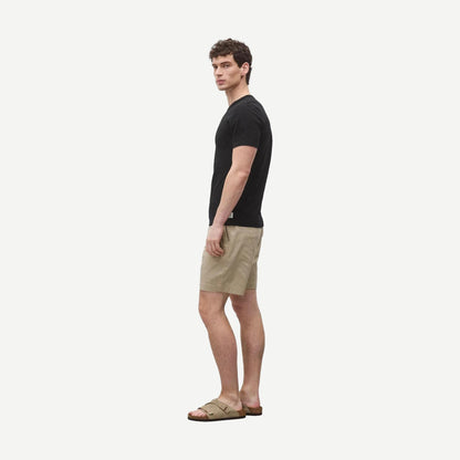 Black Reigning Champ lightweight jersey slim T-shirt displayed flat, showing its soft fabric and simple design.