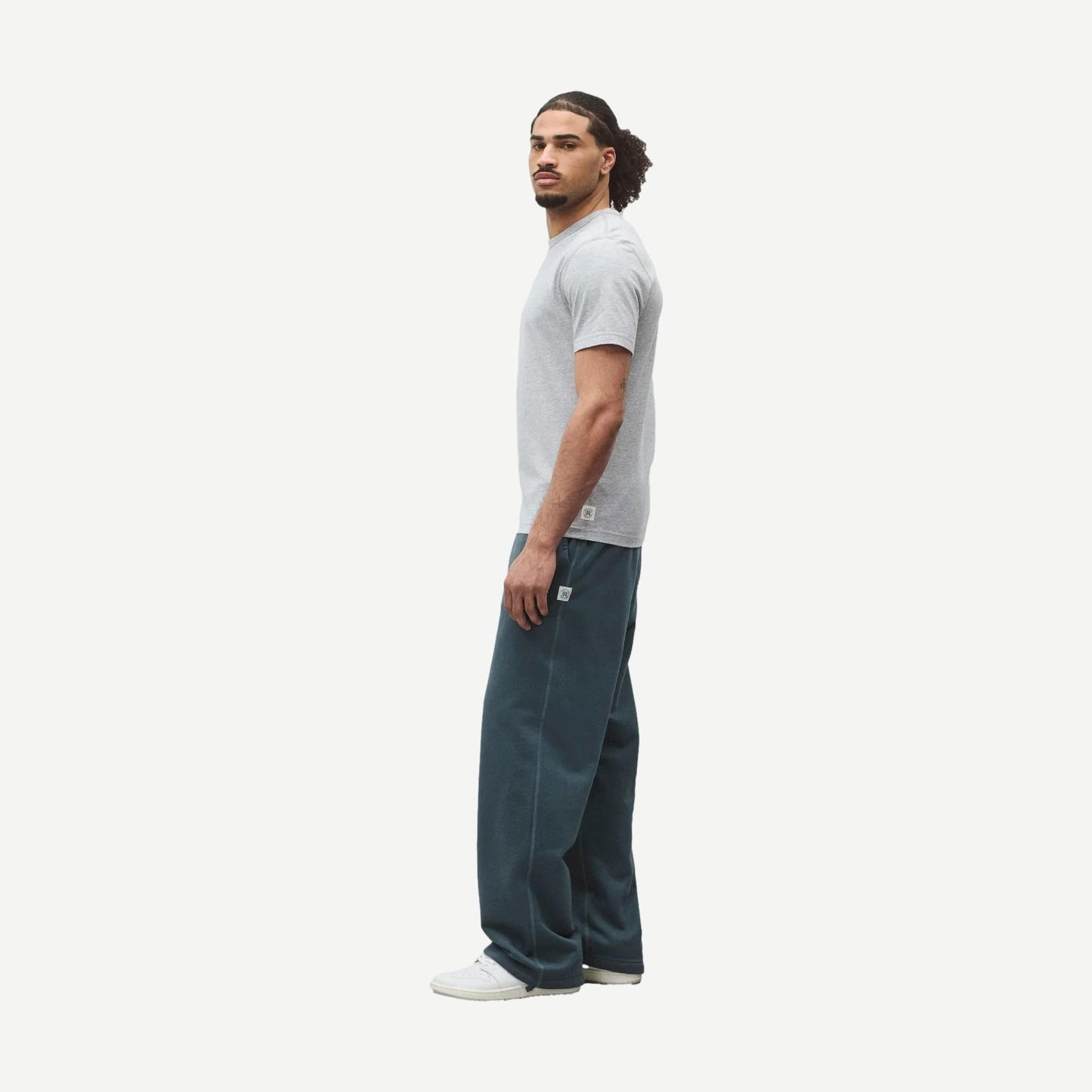 Reigning Champ lightweight grey jersey slim T-shirt displayed on a hanger, close-up of fabric texture and fit.