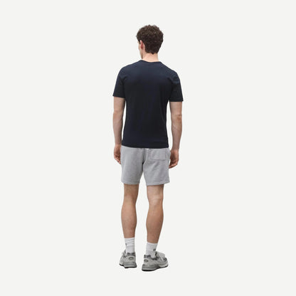 Reigning Champ navy lightweight jersey slim fit T-shirt displayed flat with visible stitching and crew neckline.