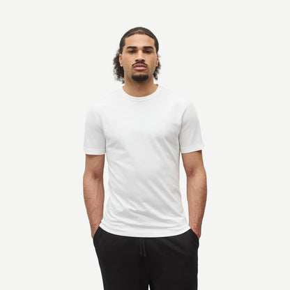 Reigning Champ lightweight white jersey slim T-shirt displayed flat, showing clean design and soft fabric texture.