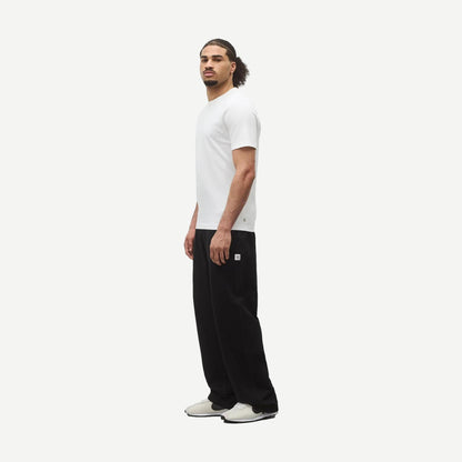 Reigning Champ lightweight white jersey slim T-shirt displayed on a hanger, showcasing its soft fabric and clean design.