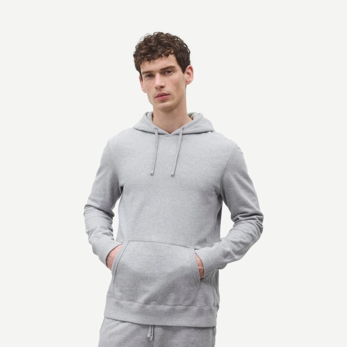 Reigning Champ men's midweight terry slim hoodie in Heather Grey, soft fabric with a relaxed fit and classic sweatshirt design.