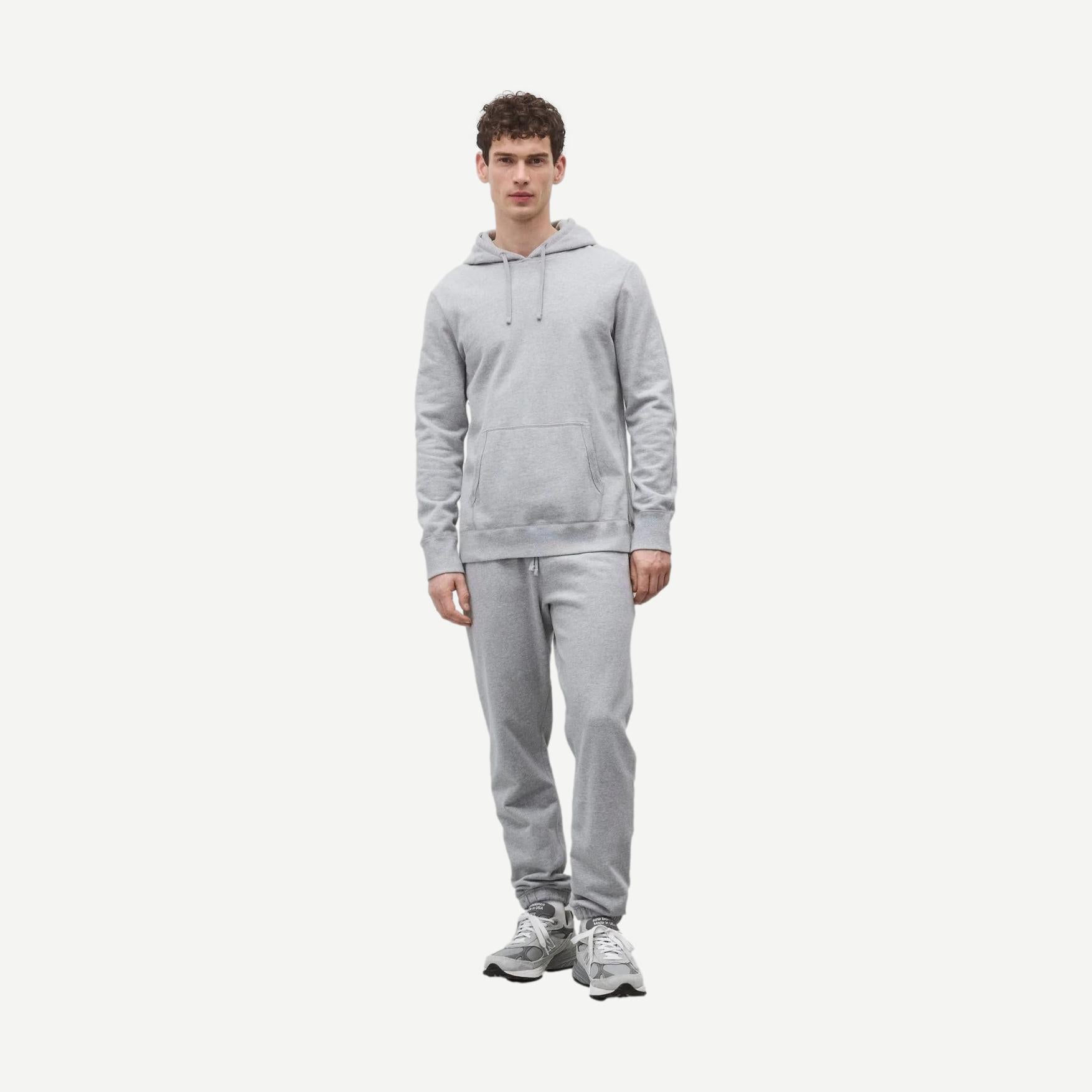Reigning Champ midweight Terry slim hoodie in Heather Grey, shown laid flat with soft fabric and ribbed cuffs.