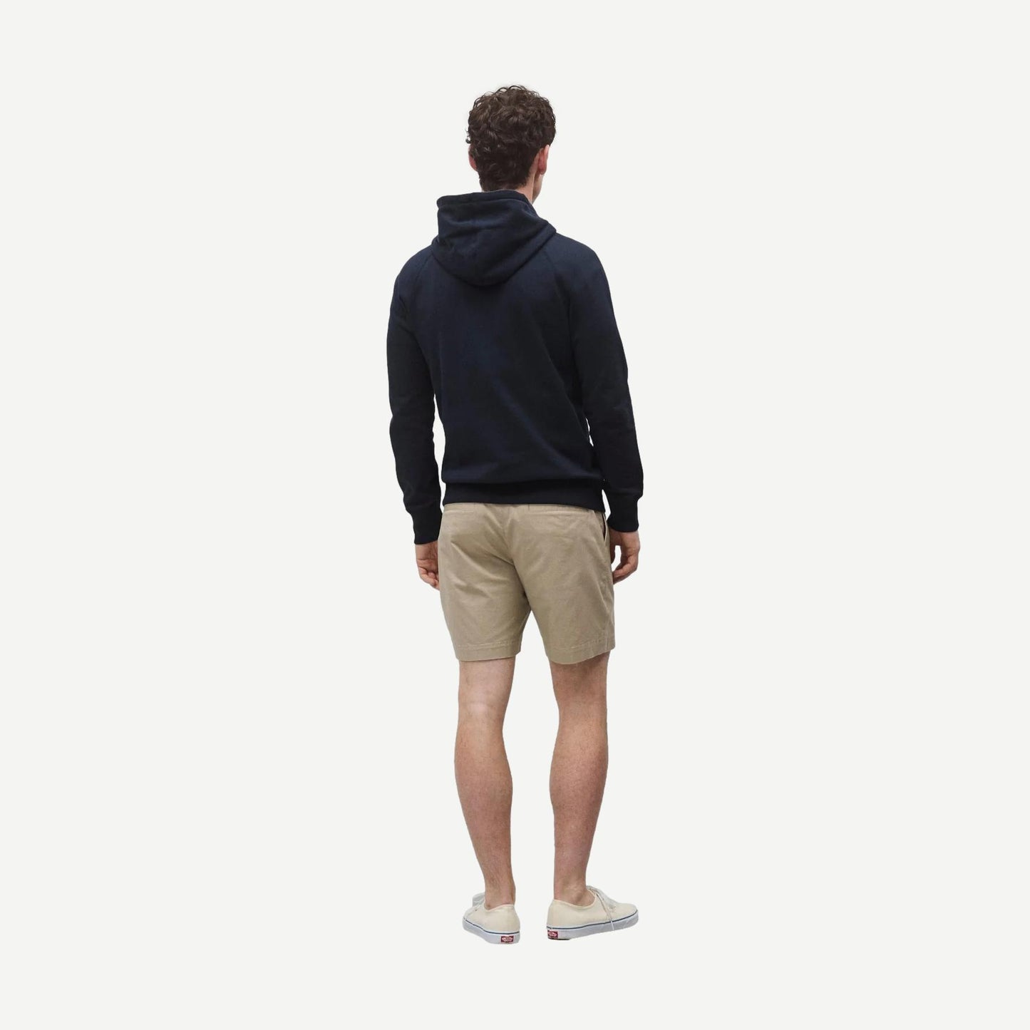 Reigning Champ navy midweight terry slim hoodie sweatshirt displayed on a model, showcasing its fit and fabric texture.