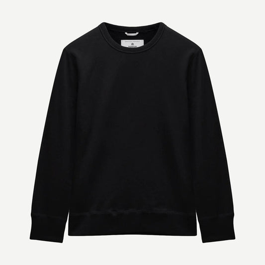 Black Reigning Champ midweight terry slim crewneck sweatshirt displayed on a neutral background.