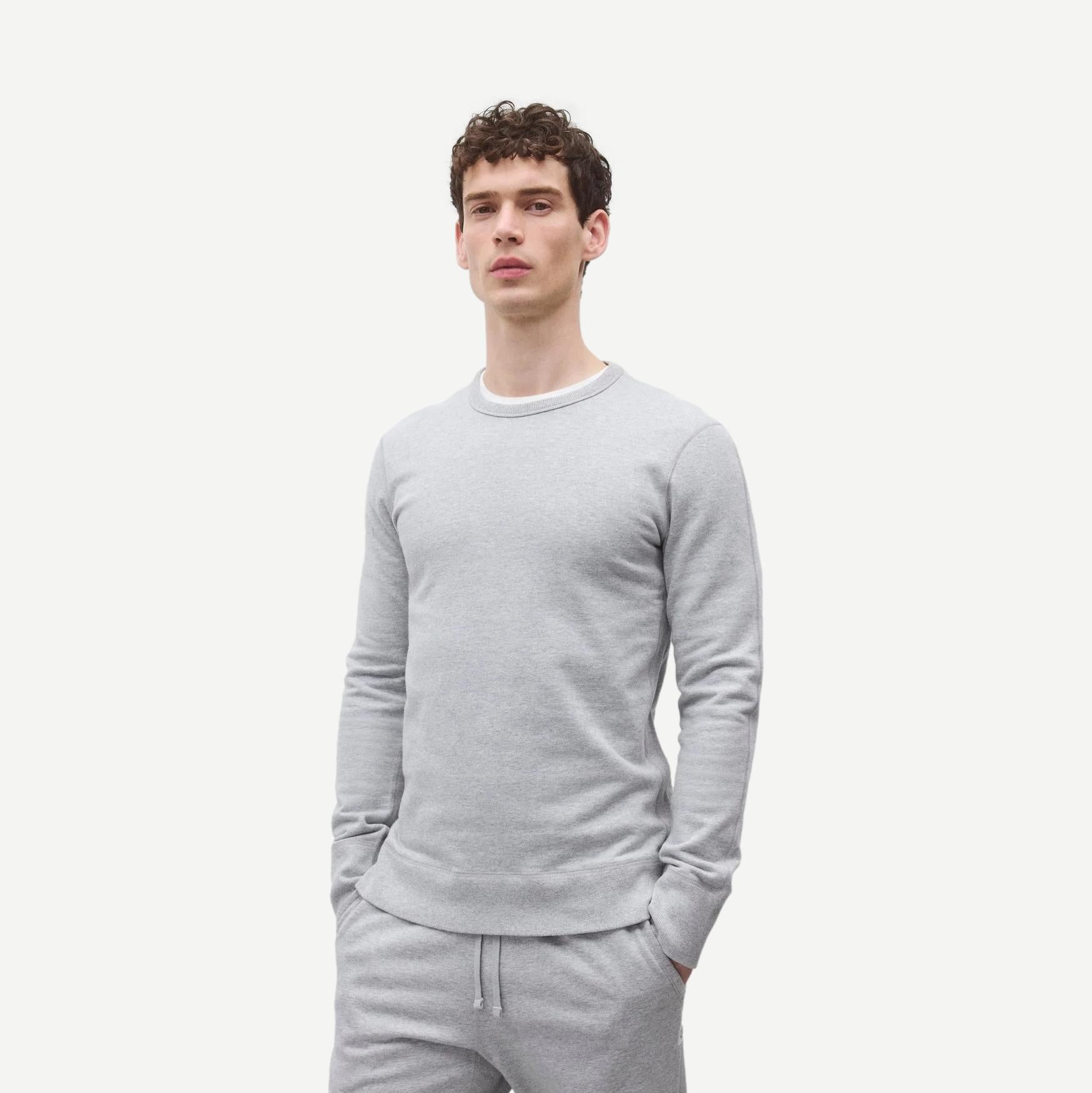 Reigning Champ midweight Terry slim crewneck sweatshirt in Heather Grey, showing close-up of fabric and fit.