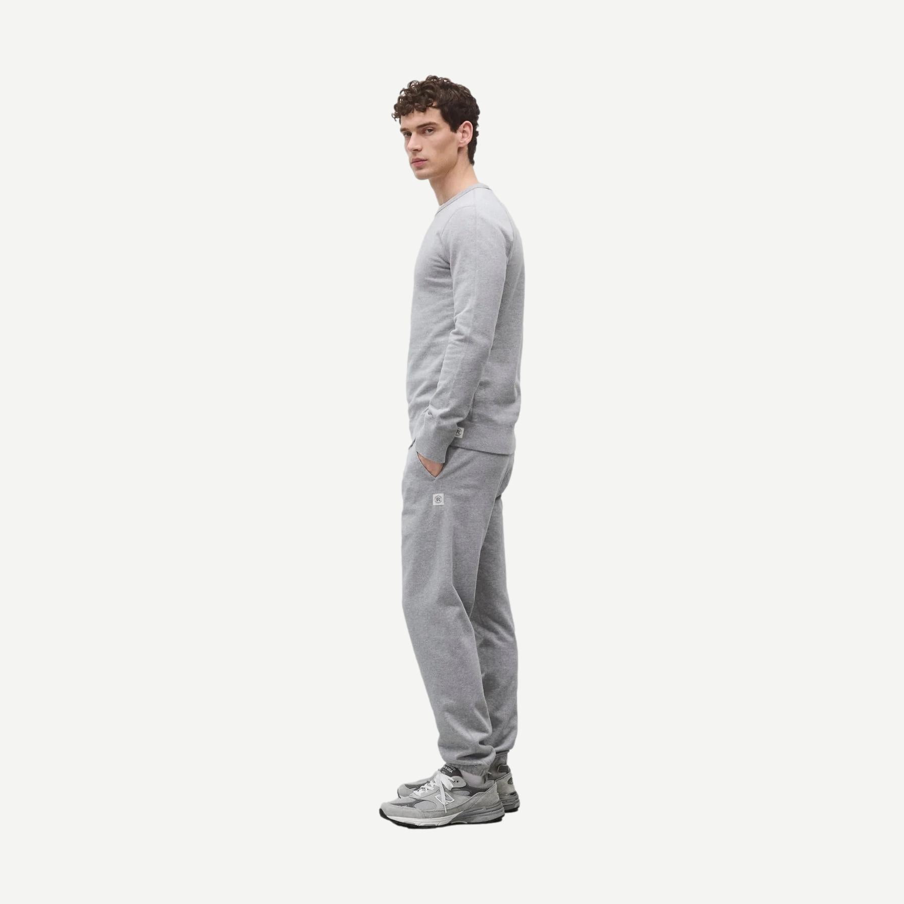 Reigning Champ midweight Terry Slim Crewneck sweatshirt in Heather Grey, showing the soft fabric and slim fit design.
