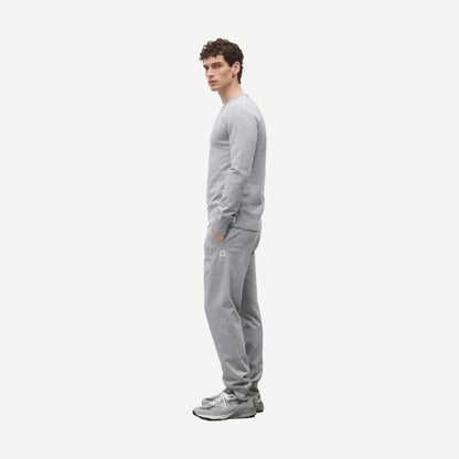 Reigning Champ midweight Terry Slim Crewneck sweatshirt in Heather Grey, showing the soft fabric and slim fit design.
