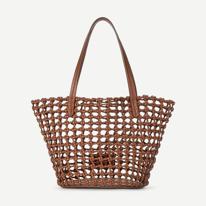 Staud Caro Bucket Bag in tan leather, stylish purses with a rounded shape, featuring a drawstring closure and shoulder strap.
