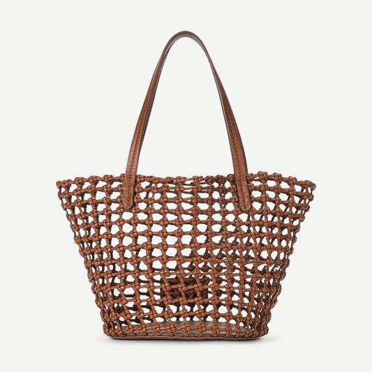 Staud Caro Bucket Bag in tan leather, stylish purses with a rounded shape, featuring a drawstring closure and shoulder strap.