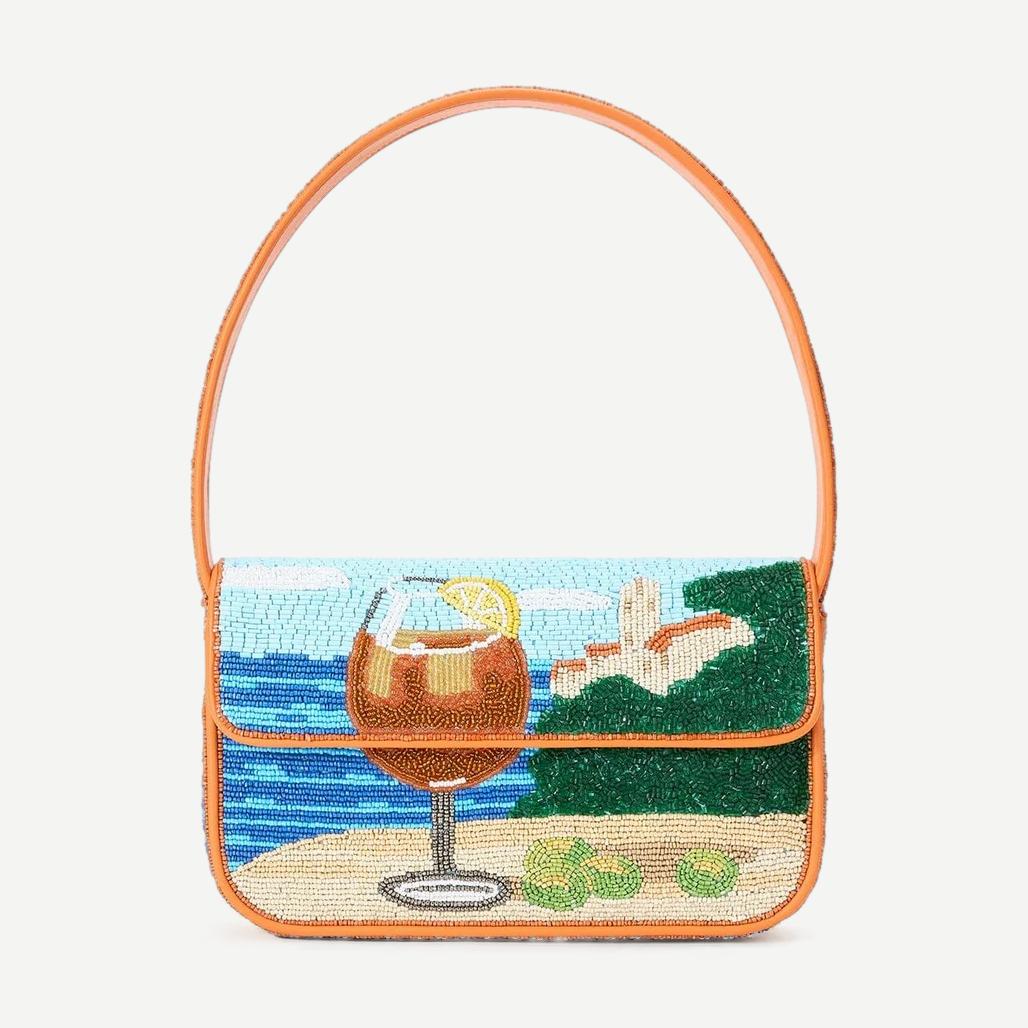 Staud Tommy Beaded Bag in Sunset Spritz with colorful beaded design, compact purse with wrist strap for stylish carrying.