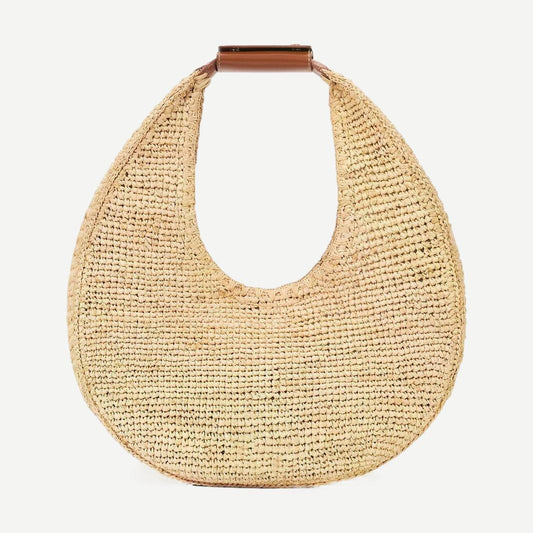 Staud Moon Raffia Tote Bag in natural and tan with woven raffia texture, open top design, and sturdy shoulder handles.