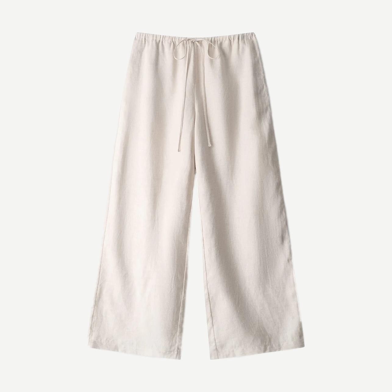 Natural linen pants from Staud's Mateo collection, featuring a relaxed fit and neutral fabric in a stylish, casual design.