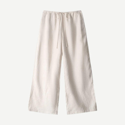 Natural linen pants from Staud's Mateo collection, featuring a relaxed fit and neutral fabric in a stylish, casual design.