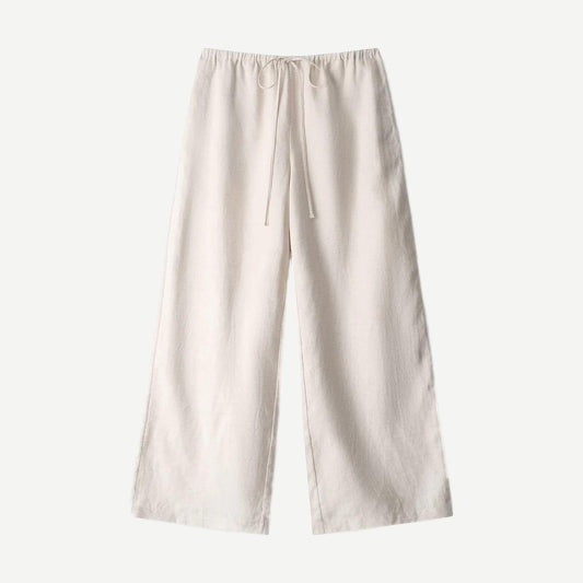 Natural linen pants from Staud's Mateo collection, featuring a relaxed fit and neutral fabric in a stylish, casual design.