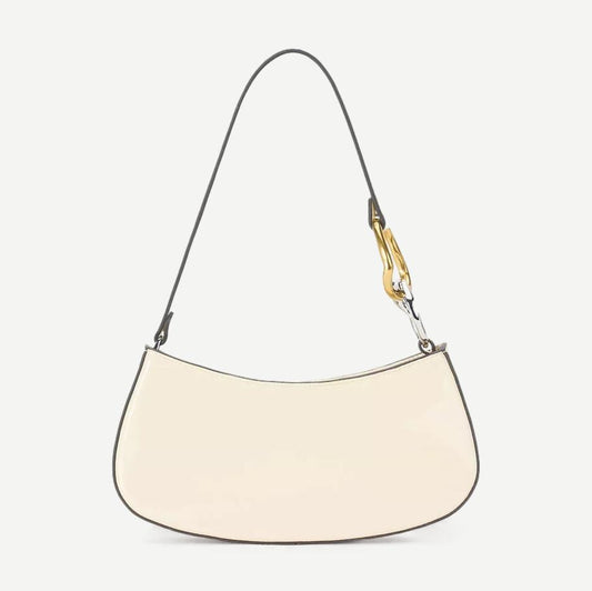 Cream Ollie Bag purse by Staud featuring a sleek design and minimalist style, shown in a close-up shot highlighting its shape.