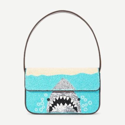 Staud Tommy beaded purse in white with intricate beaded detailing and compact design, perfect for stylish accessories.