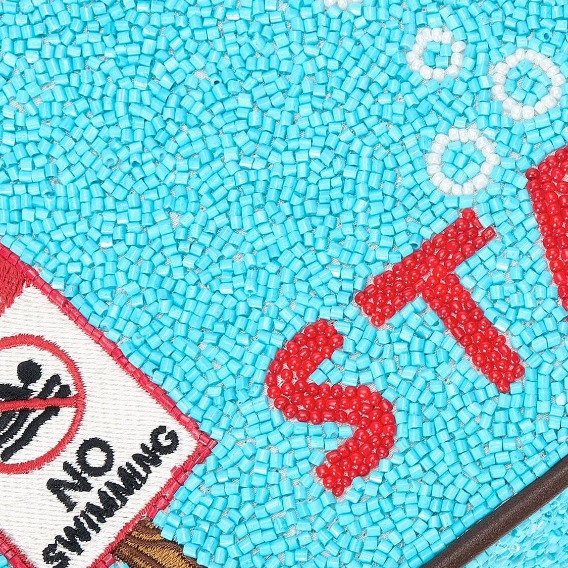 Staud Tommy beaded purse in Great White with intricate beadwork, small structured shape, and elegant design.
