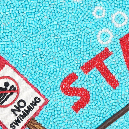 Staud Tommy beaded purse in Great White with intricate beadwork, small structured shape, and elegant design.