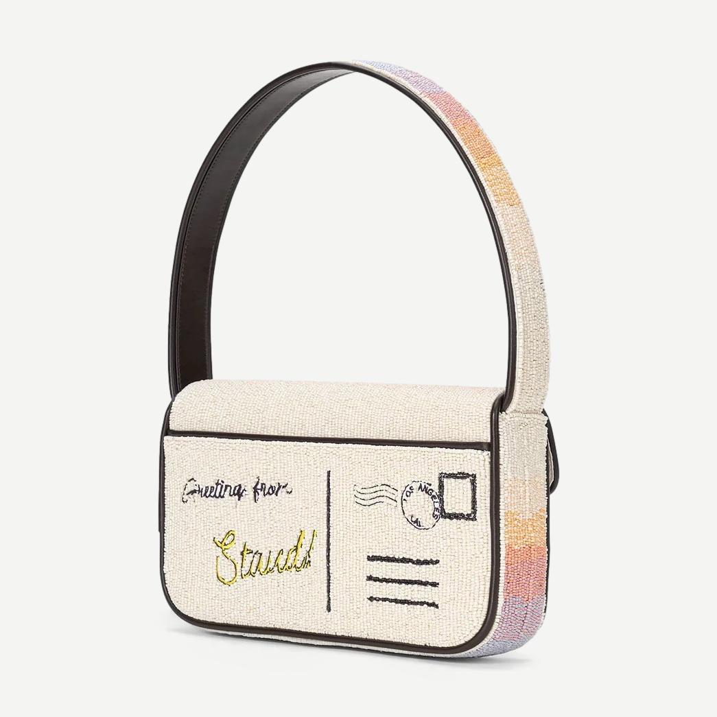 Staud Tommy beaded purse featuring Santa Monica Sunset design with colorful beads and a compact, stylish shape.