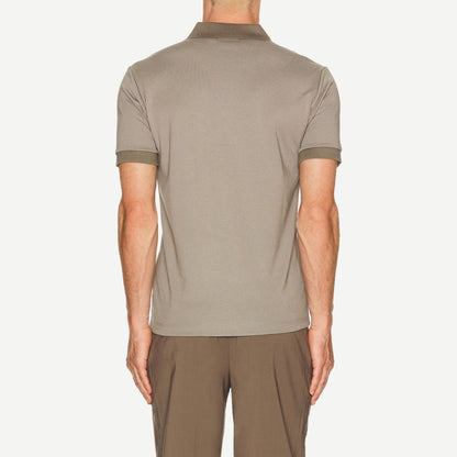 Theory Geo Polo in Mod Jacquard fabric featuring a multicolor geometric pattern, classic polo collar, and short sleeves.