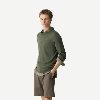 Theory crewneck sweater in regal wool, light ivy color, with a close-up of the soft knit fabric and classic fit.