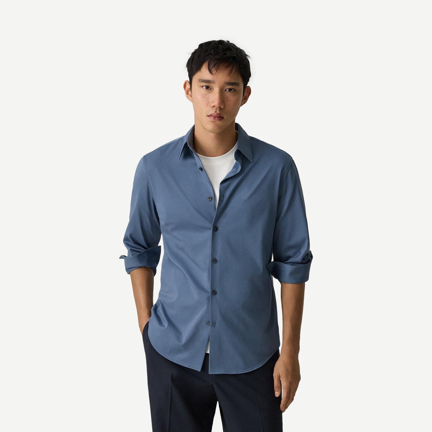 Theory Sylvain Structure Knit shirt in Bering color, featuring a sleek knit design and classic fit, shown on a model.