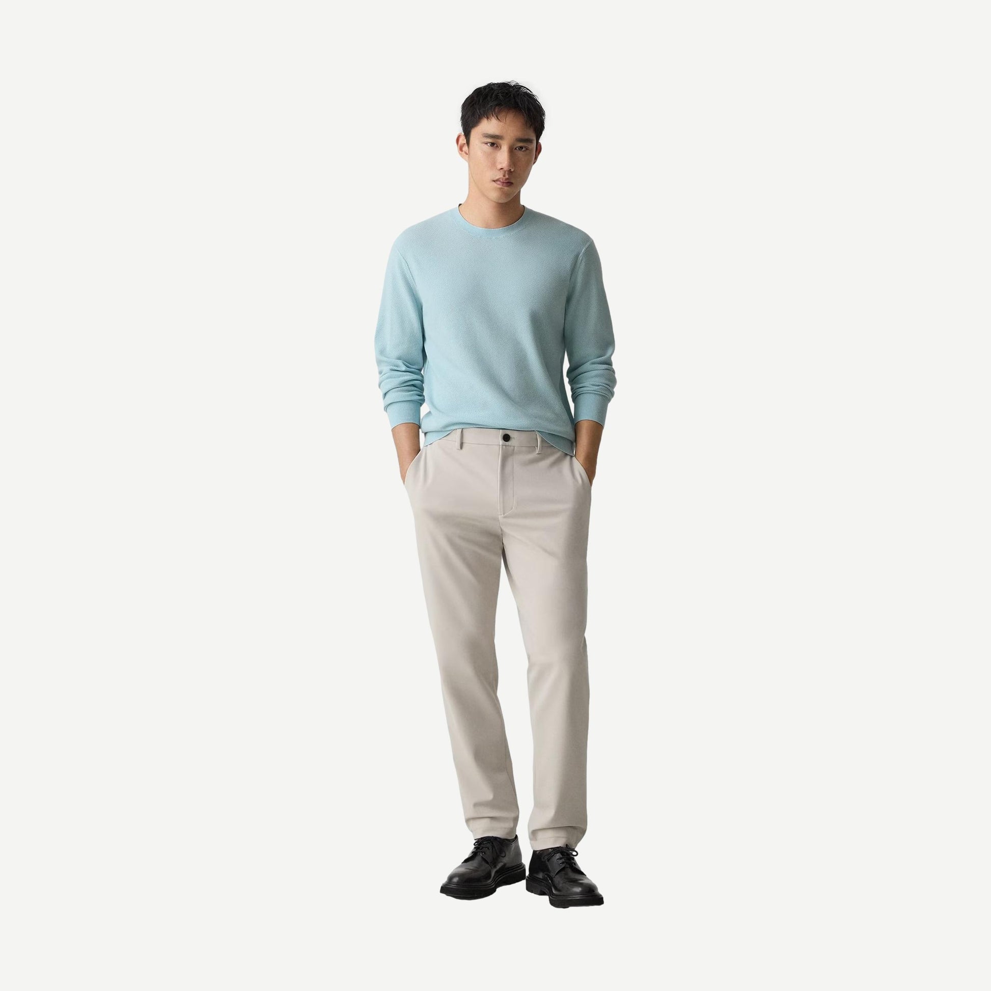 Theory Riland crewneck sweater in Light Ocean Air color, soft knit fabric, close-up of the collar and sleeve detail.