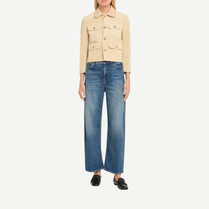 Nili Lotan Tribeca Jean in classic wash denim, showcasing a slim fit design with visible stitching and five-pocket styling.