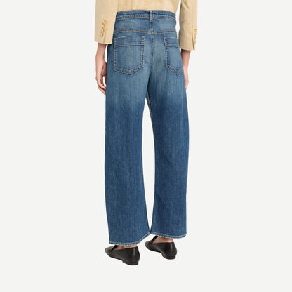 Nili Lotan Tribeca Jean in Classic Wash denim, showing a close-up of the stylish, fitted denim jeans with subtle fading and stitching details.