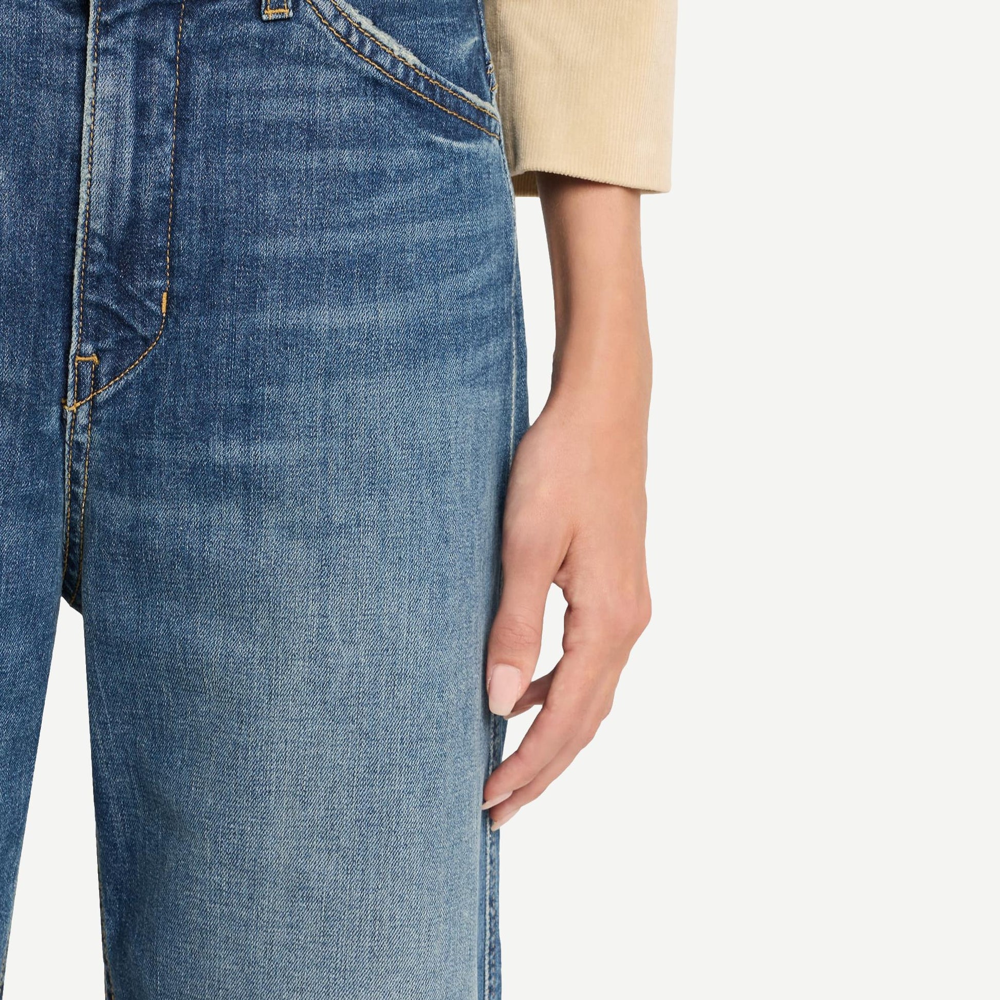 Nili Lotan Tribeca Jean in classic wash denim, showcasing a stylish, slim-fit design with traditional five-pocket styling.