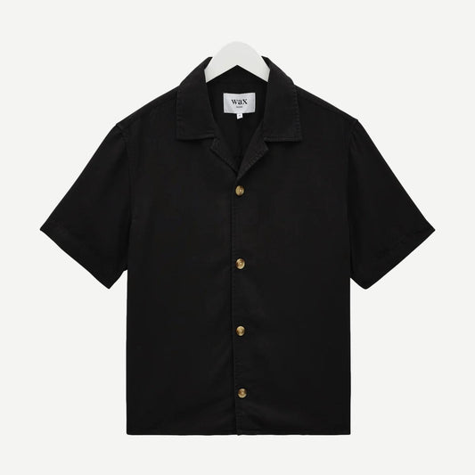 Wax London Curzon SS shirt in black, drapey Tencel twill fabric, short-sleeve design, stylish and lightweight for casual wear.