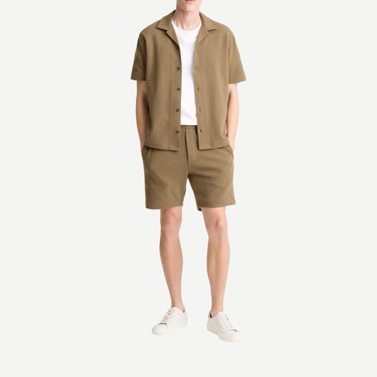 Vince Cabana shirt in Kalamata color, lightweight cotton shirt with a relaxed fit and button-down front, displayed on a hanger.